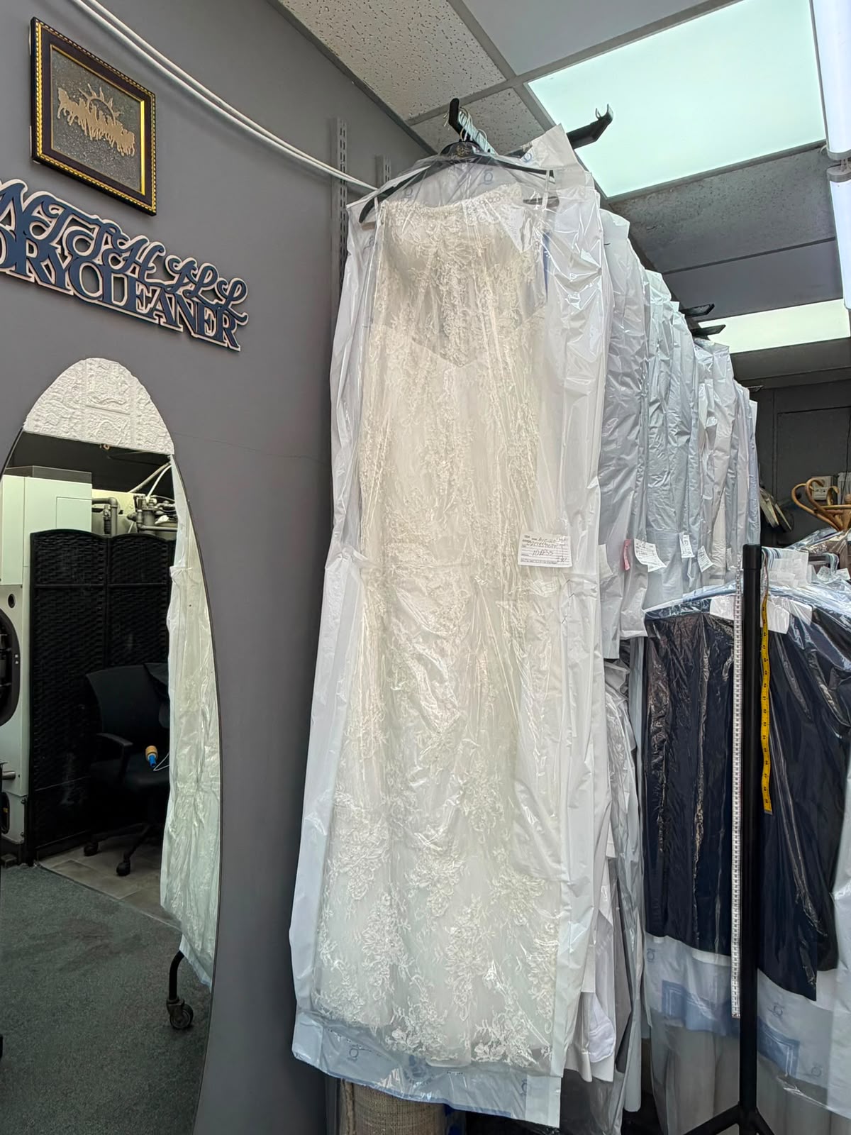 Wedding dress and formal garments inside Gants Hill Dry Cleaners